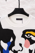 White crewneck sweater with neckline tag and large black graphic face