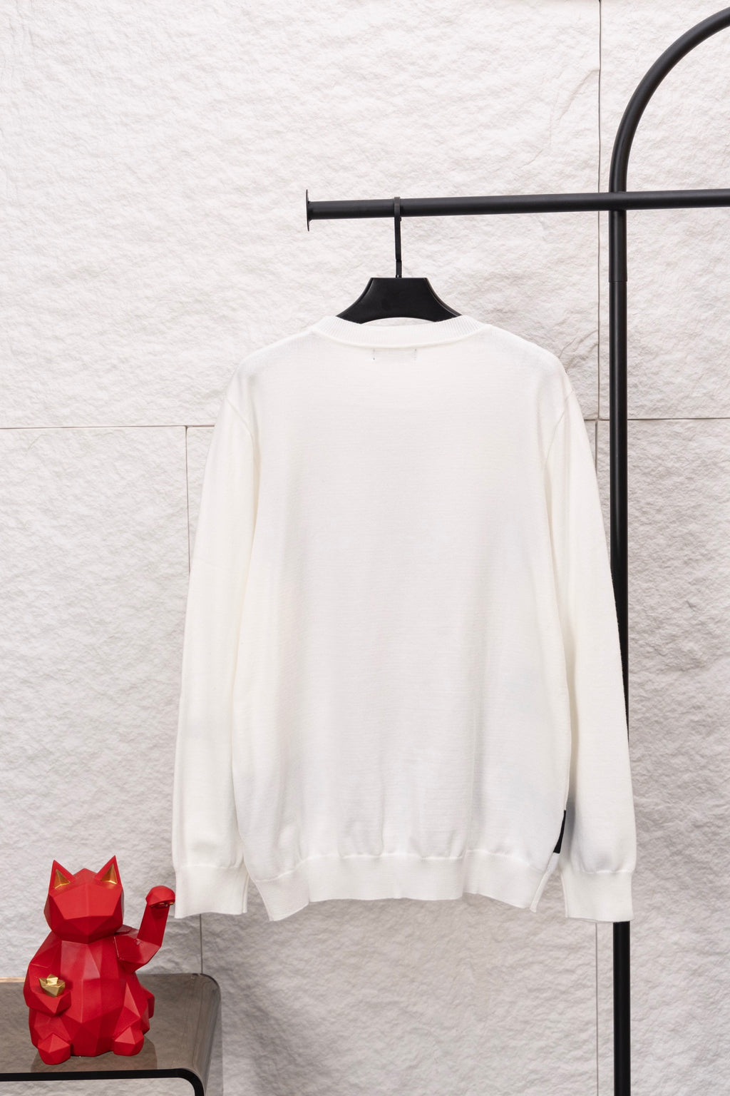 White long-sleeve crewneck sweater, plain back with ribbed cuffs and hem