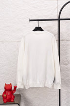 White long-sleeve crewneck sweater, plain back with ribbed cuffs and hem