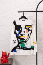White crewneck sweater with large colorful face graphic on front