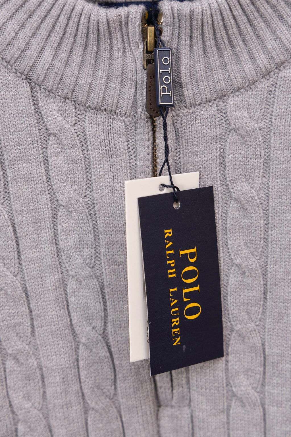 Light gray knit sweater showing Polo Ralph Lauren label on zipper placket