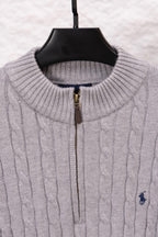Light gray ribbed stand-collar sweater with gold zipper and polo logo