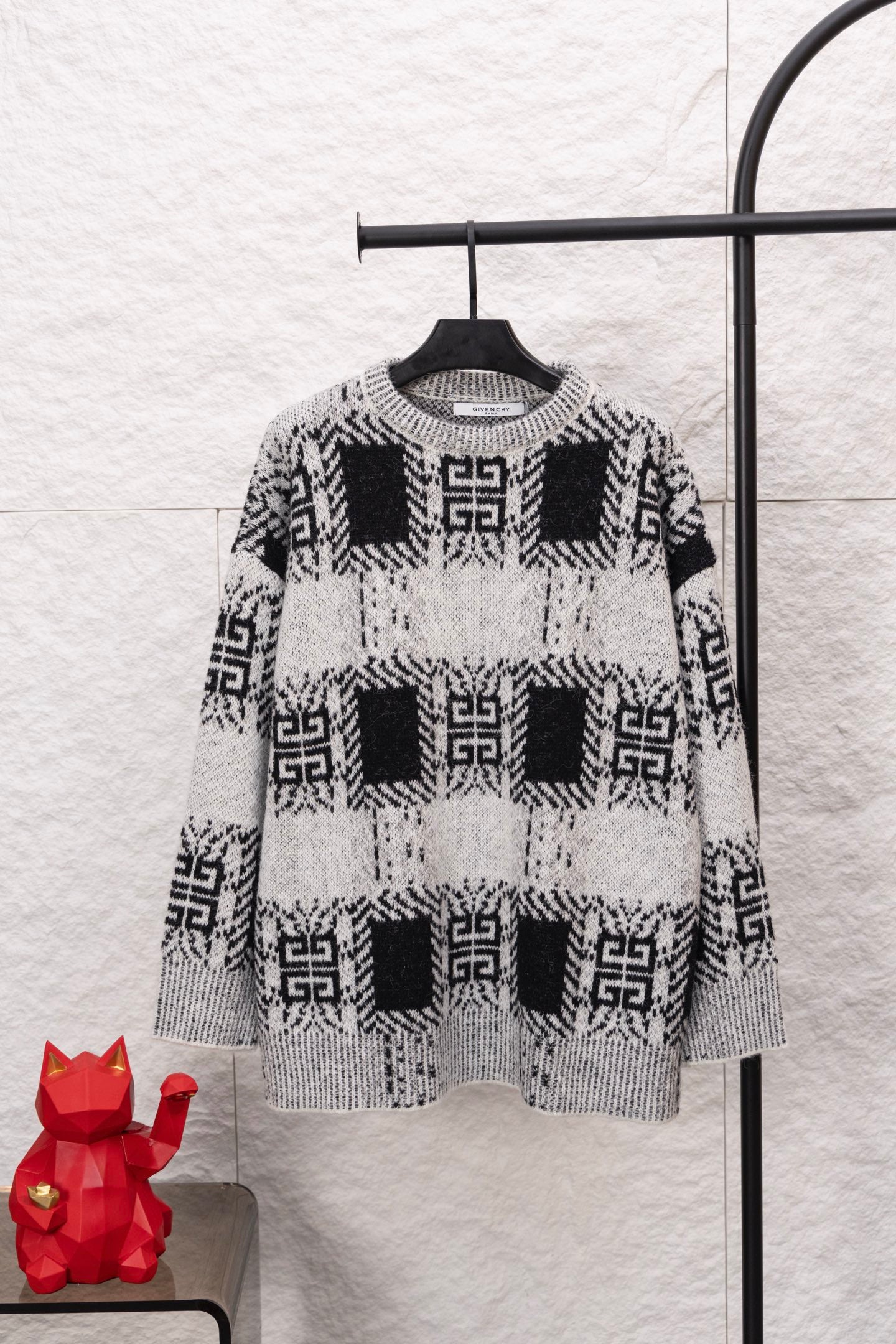Givenchy knit sweater with black and white geometric pattern, crew neck, long sleeves