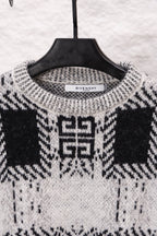 Givenchy knit sweater neckline in black and white with geometric pattern; brand label