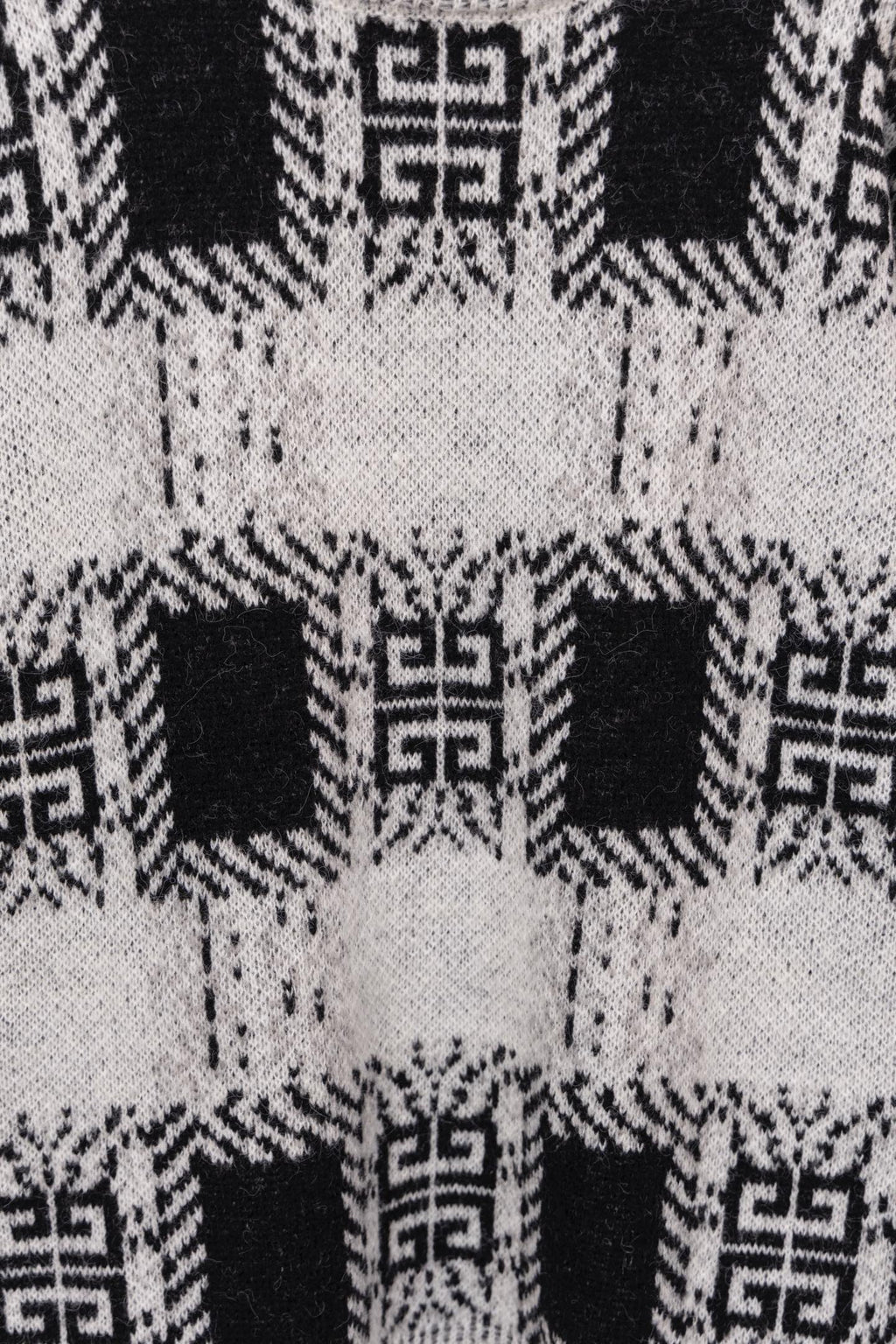 Givenchy knit sweater back pattern close-up in black and white geometric motifs