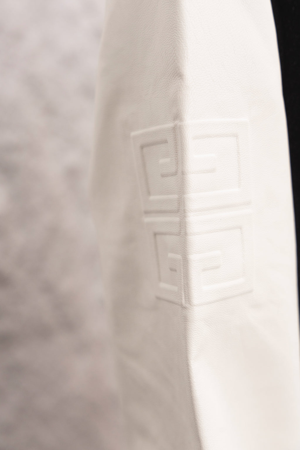 Givenchy white sleeve with subtle embossed logo detail