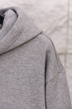 Heather gray hoodie shoulder and hood seam detail