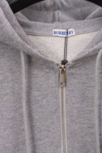 Burberry long zip-up hoodie close-up: hood lining and metal front zipper