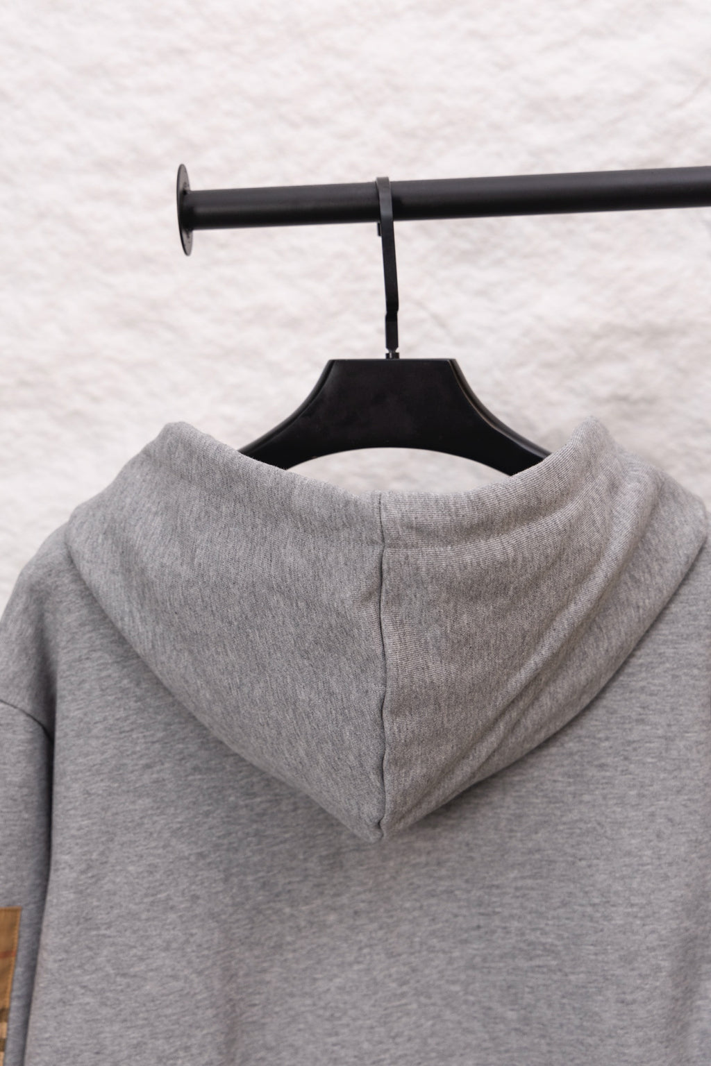 Burberry long zip-up hoodie heather gray with hood, back view, zipper seam visible
