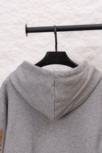 Burberry long zip-up hoodie heather gray with hood, back view, zipper seam visible