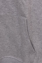Heather gray hoodie front pocket and drawstring hem seam detail