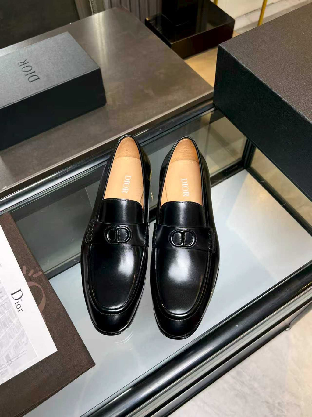 Black leather loafers with Dior monogram buckle detail, unisex style