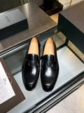 Black leather loafers with Dior monogram buckle detail, unisex style