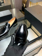 Black leather loafer with Dior logo on heel tab, unisex slip-on style
