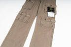 Tan cargo pants close-up with front flap pockets and brand tag on waistband