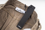 Stone Island tan pant waistband with attached label and hanging tag