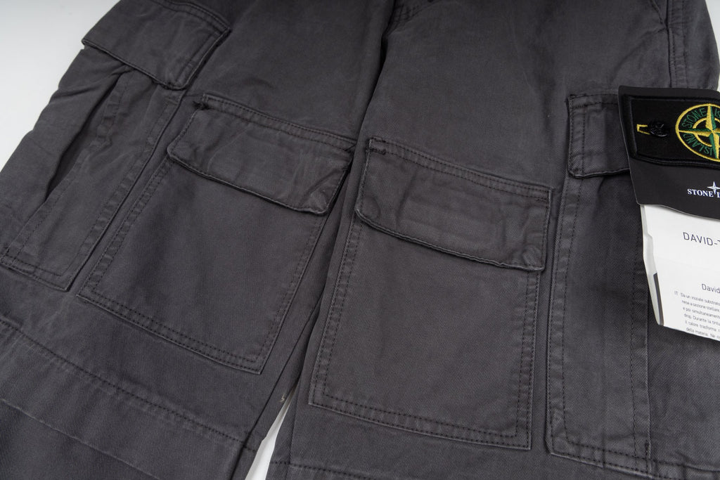 Stone Island cargo pants detail view, dark gray stitched pockets and seams