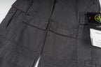 Stone Island cargo pants detail view, dark gray stitched pockets and seams