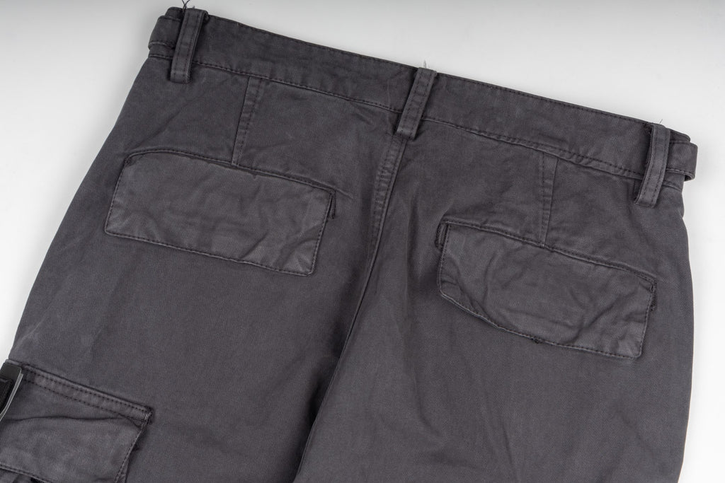 Stone Island cargo pants close-up of front pockets, dark gray