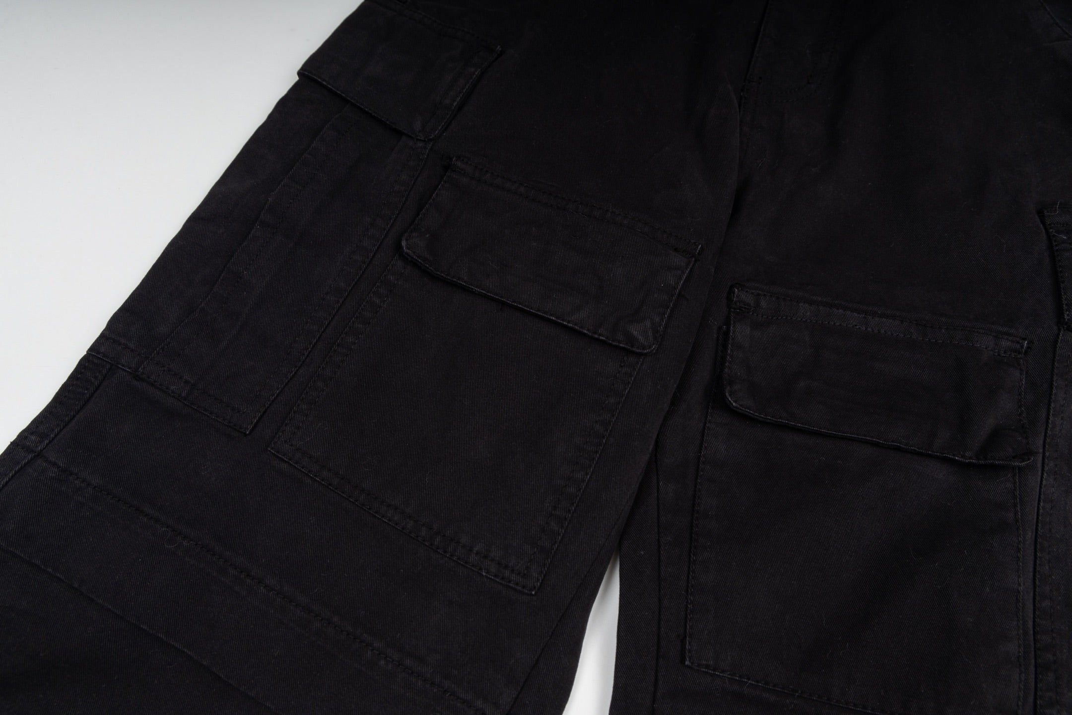 Black cargo trousers with front flap and patch pockets