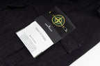 Black cargo trousers with Stone Island hang tag and care labels