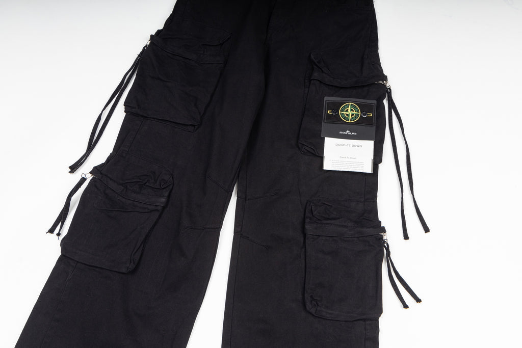 Stone Island cargo pants in black, close-up of cargo pockets and drawstring ties