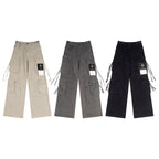 Stone Island cargo pants set in sand, charcoal, and black