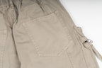 Stone Island cargo pants in sand, close-up of flap cargo pocket detail