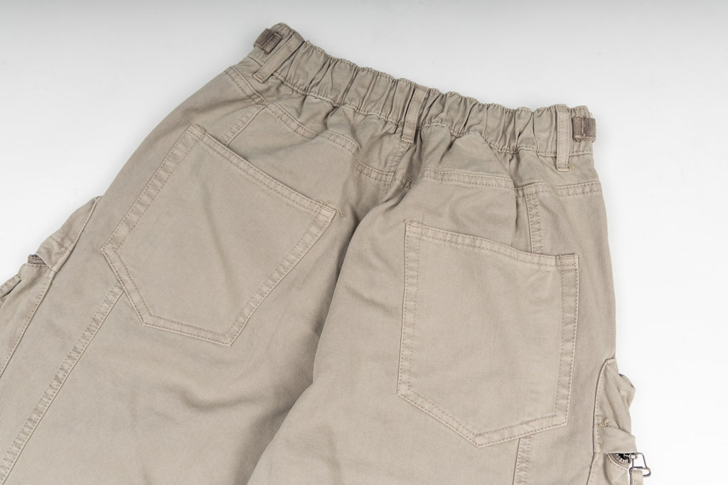 Stone Island cargo pants in sand, close-up of waistband and pocket