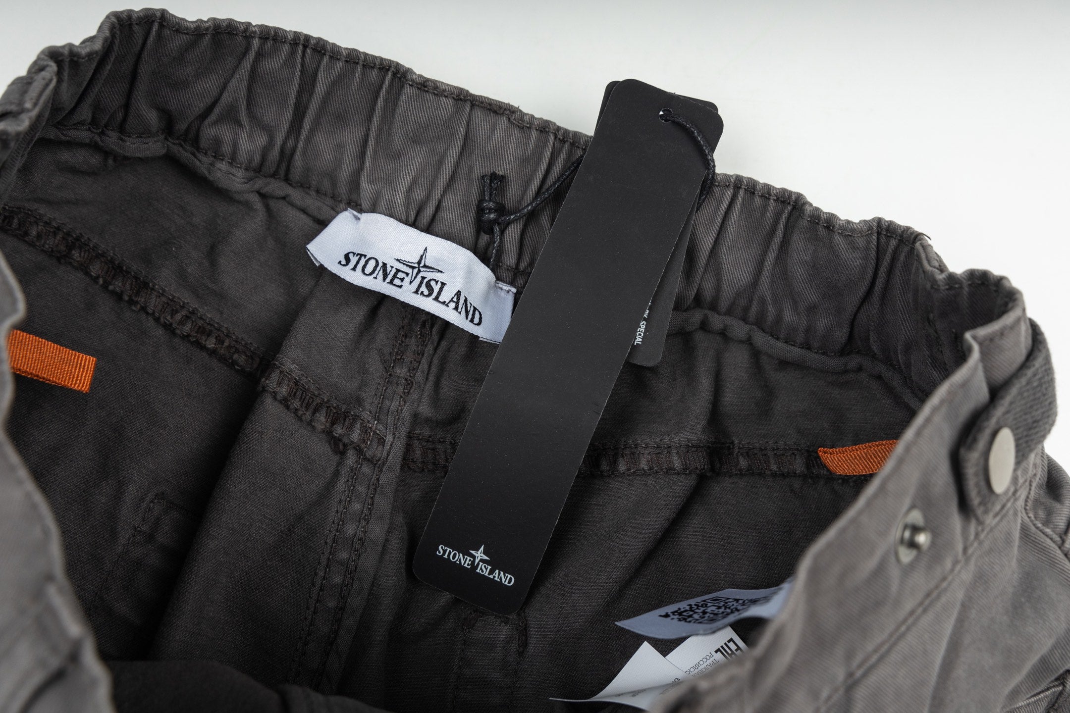 Stone Island stonewashed charcoal pants, elastic waistband with inner label
