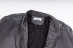 Dark gray bomber jacket neckline with inner label and visible zipper opening