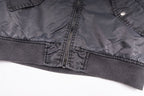 Dark gray bomber jacket front hem with central zipper and ribbed waistband