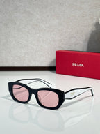 Prada sunglasses with black frame and light pink lenses, side Prada logo.