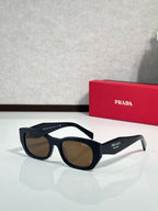 Prada sunglasses with black frame and dark brown lenses, side Prada logo.