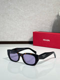 Prada sunglasses with black frame and purple-tinted lenses, side logo accents.