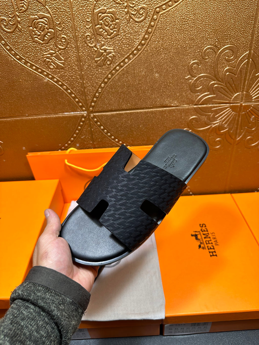 Hermes slide sandals on orange box: dark gray textured strap with open toe