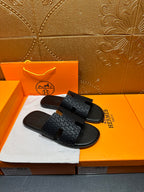 Hermes slide sandals, dark gray textured footbed and strap with H-style cutout