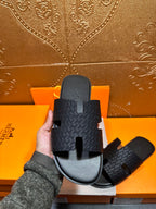 Hermes slide sandals, dark gray textured upper with toe strap cutout and contoured footbed