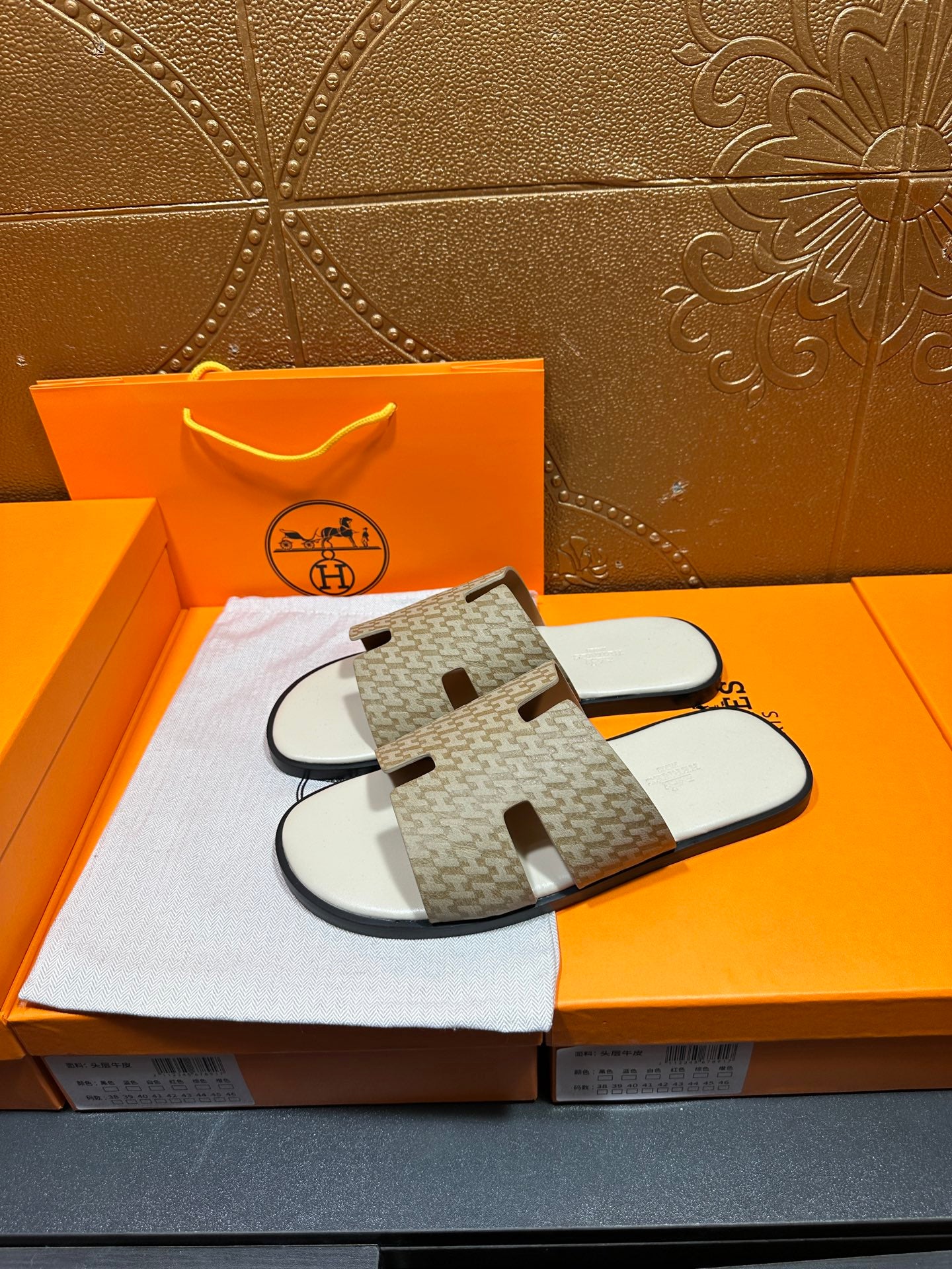 Hermes slide sandals with taupe patterned crossover straps and white sole