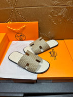 Hermes slide sandals with patterned straps and white top with molded footbed