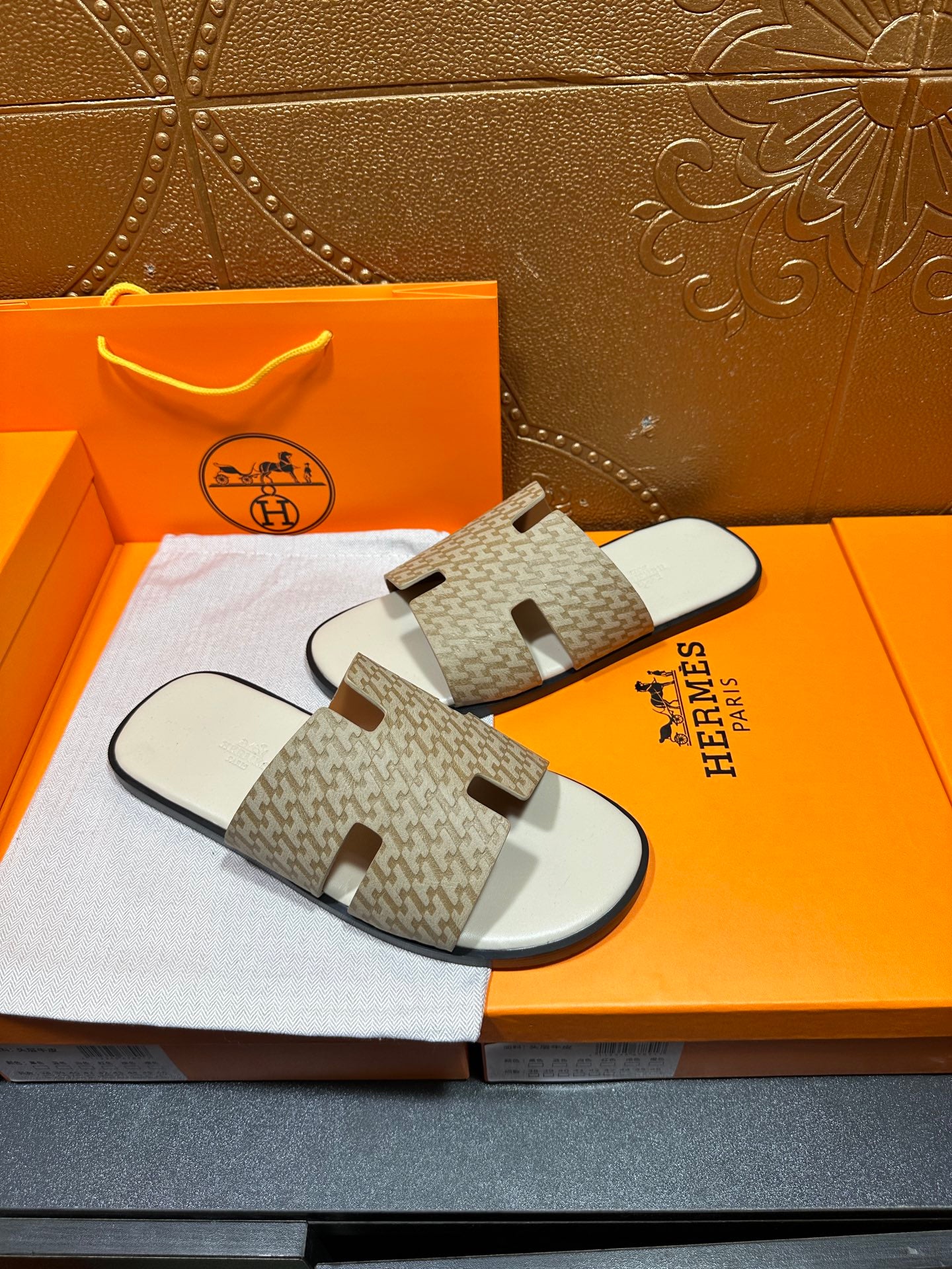 Hermes slide sandals with patterned straps and white top with molded footbed