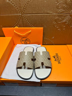 Hermes slide sandals with patterned straps and white footbed