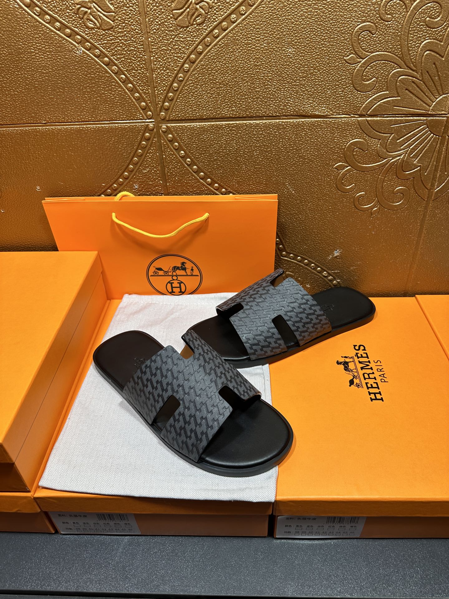 Hermes slide sandals in charcoal with patterned straps and black rubber footbeds