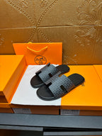Hermes slide sandals, charcoal patterned band straps over black rubber soles