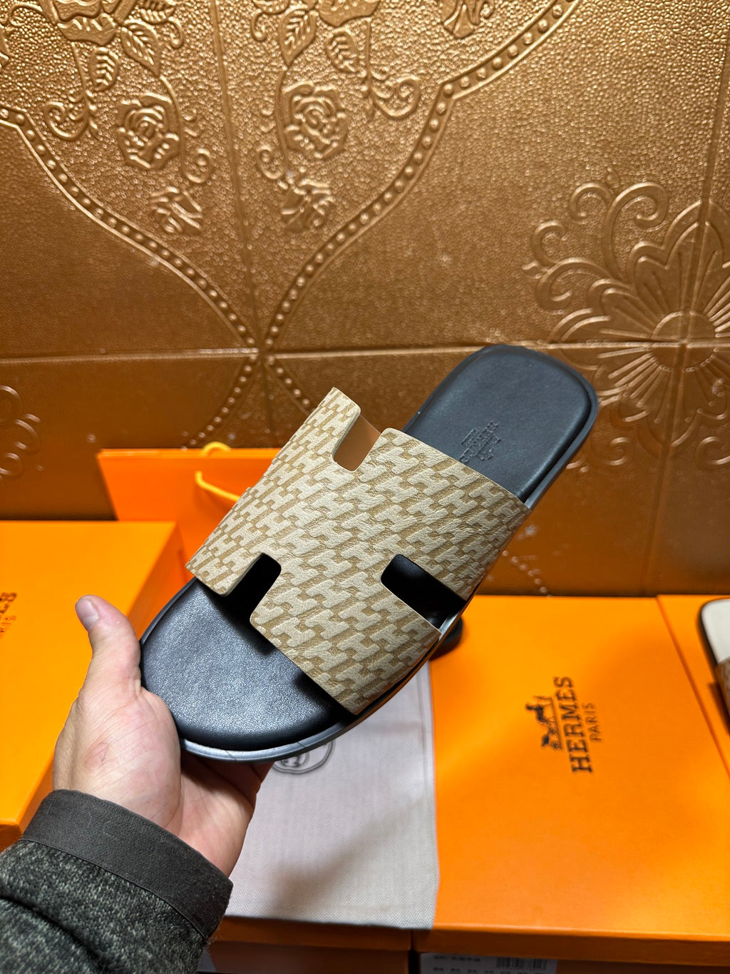 Beige patterned slide sandal with black outsole and crossover top strap