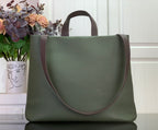Olive green Louis Vuitton tote bag with curved front and brown trim handles