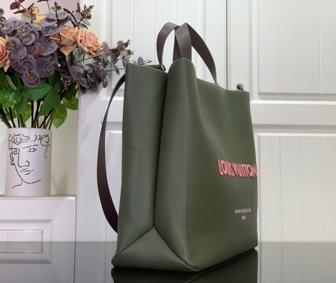 Olive green Louis Vuitton tote bag, side view with handles and logo