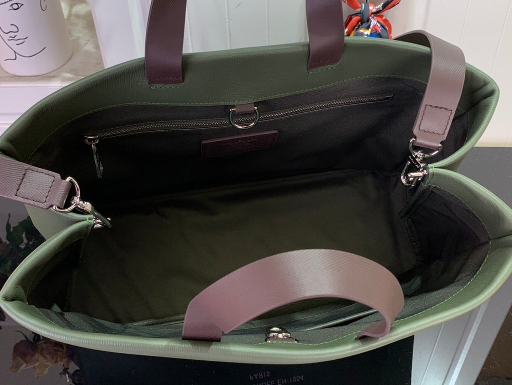 Olive green Louis Vuitton tote bag interior with black lining and zip pocket