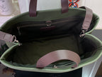 Olive green Louis Vuitton tote bag interior with black lining and zip pocket