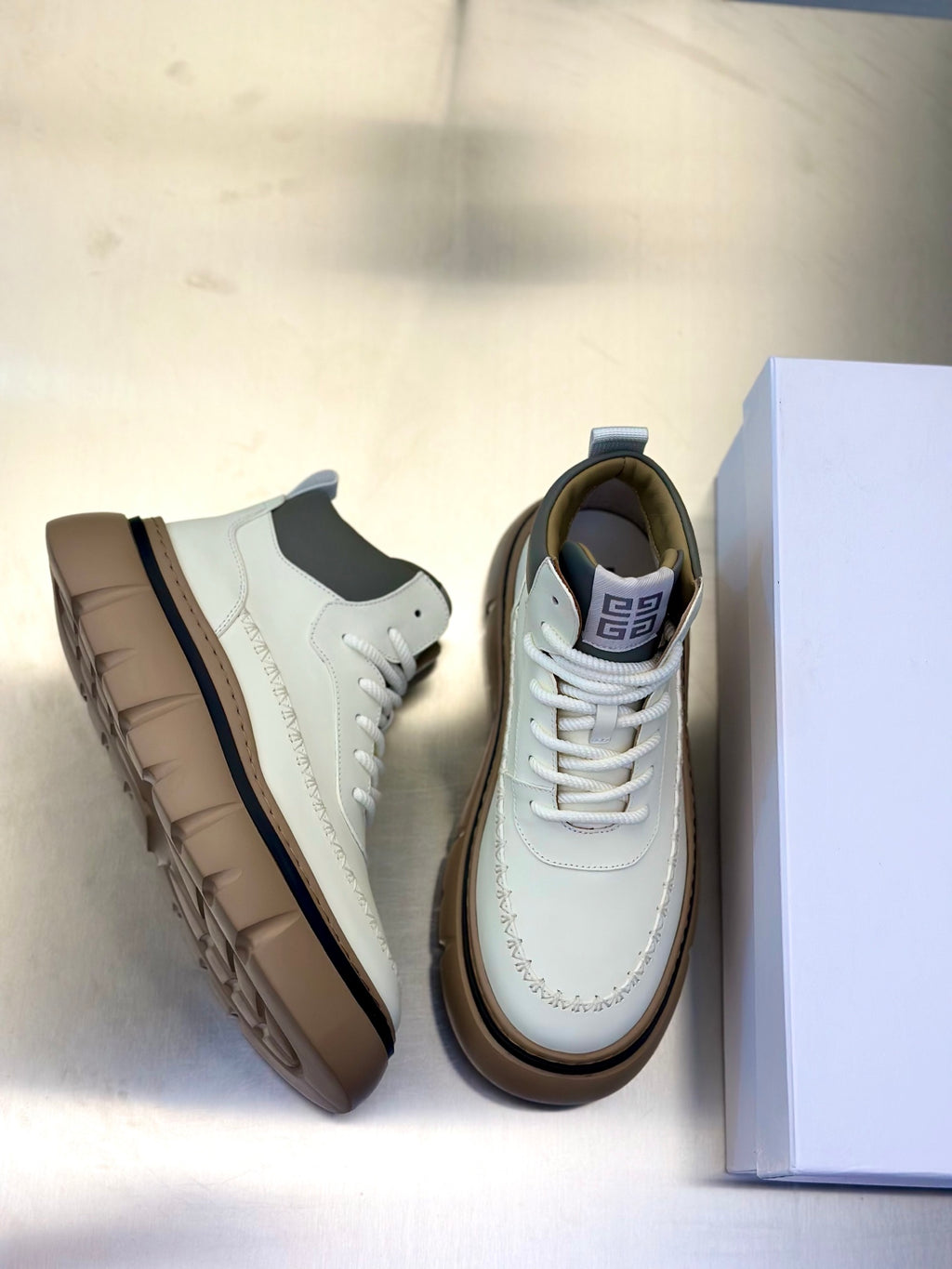 Givenchy lace-up sneakers, off-white leather upper with textured sole and visible laces